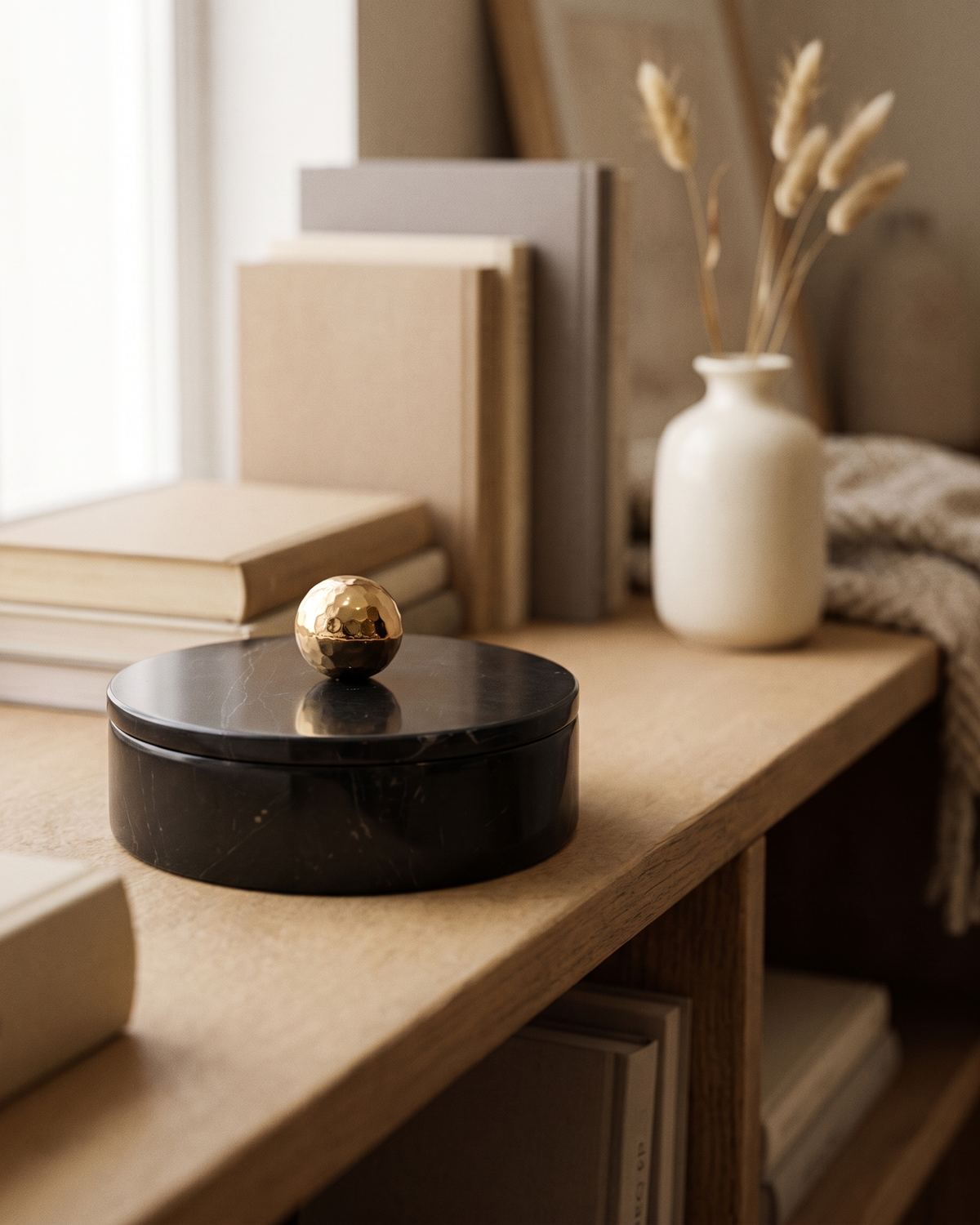 Black Marble Box with Brass Knob (One Piece) styled in a warm interior