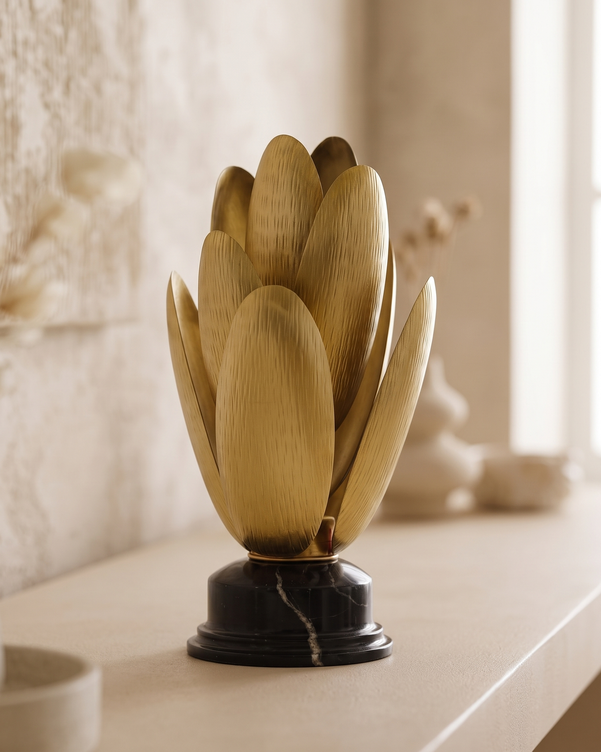 Brass Lotus Flame Sculptural Decor - styled on a warm beige console in a cosy interior