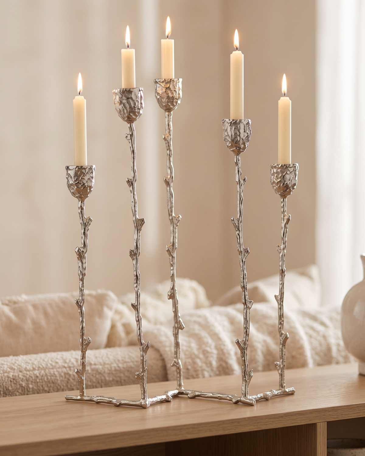 Five-Arm Brass Candelabra Silver - with lit candles, styled on a warm beige console in a cosy interior