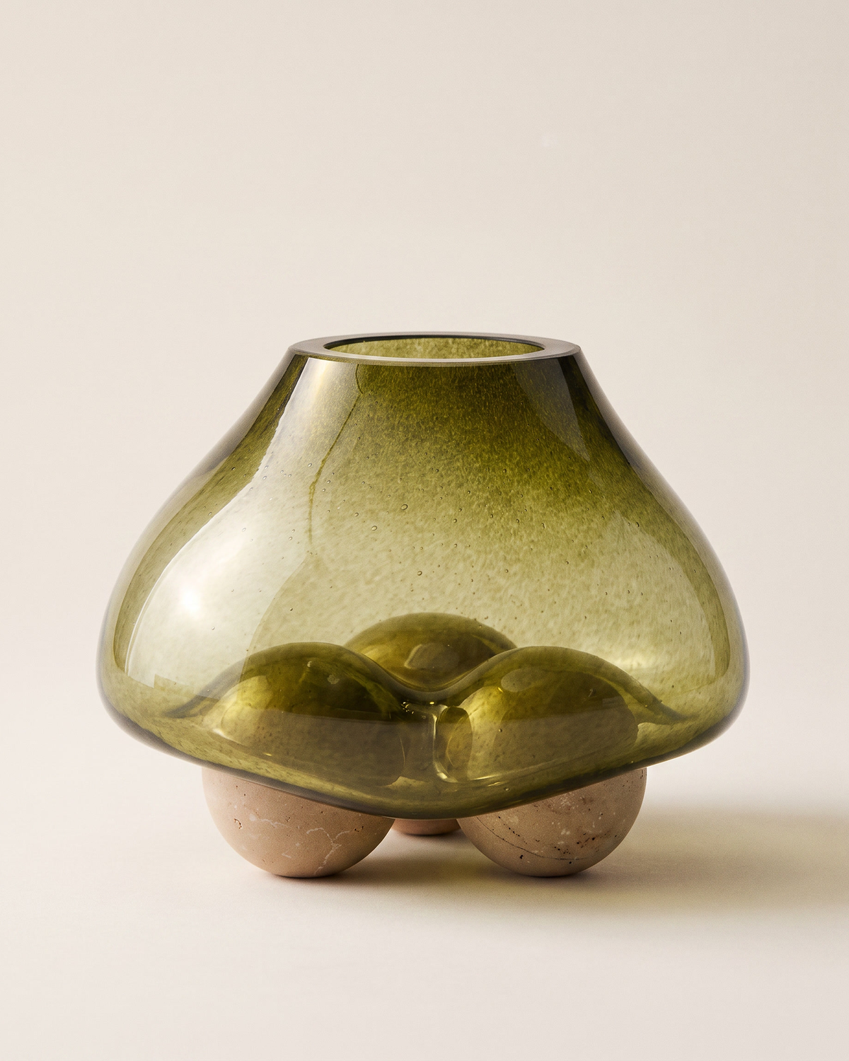 Glass Bowl with Three Spheres I on a pale ivory studio background