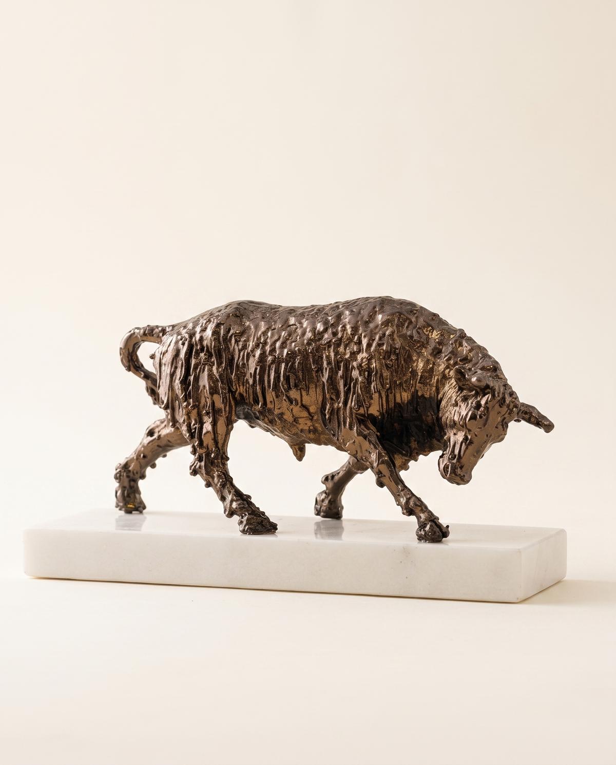 Bronze Bull Sculpture On White Marble Base