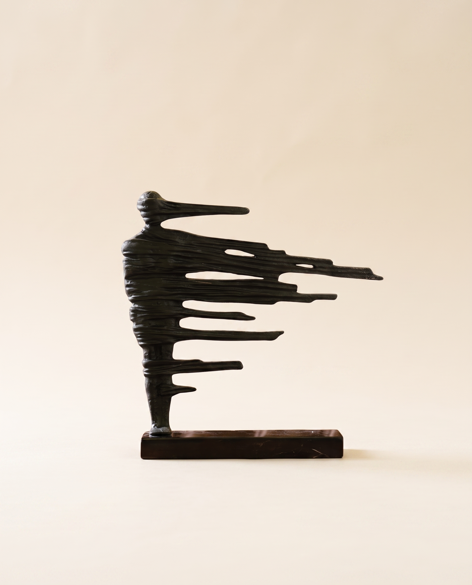 Brass Wind Woman Sculpture - warm ivory studio hero shot