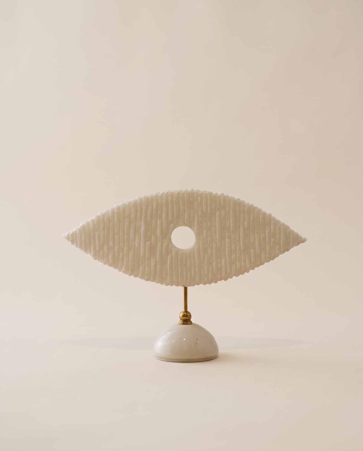 White Marble Eye Sculpture With Brass Stand - warm ivory studio hero shot