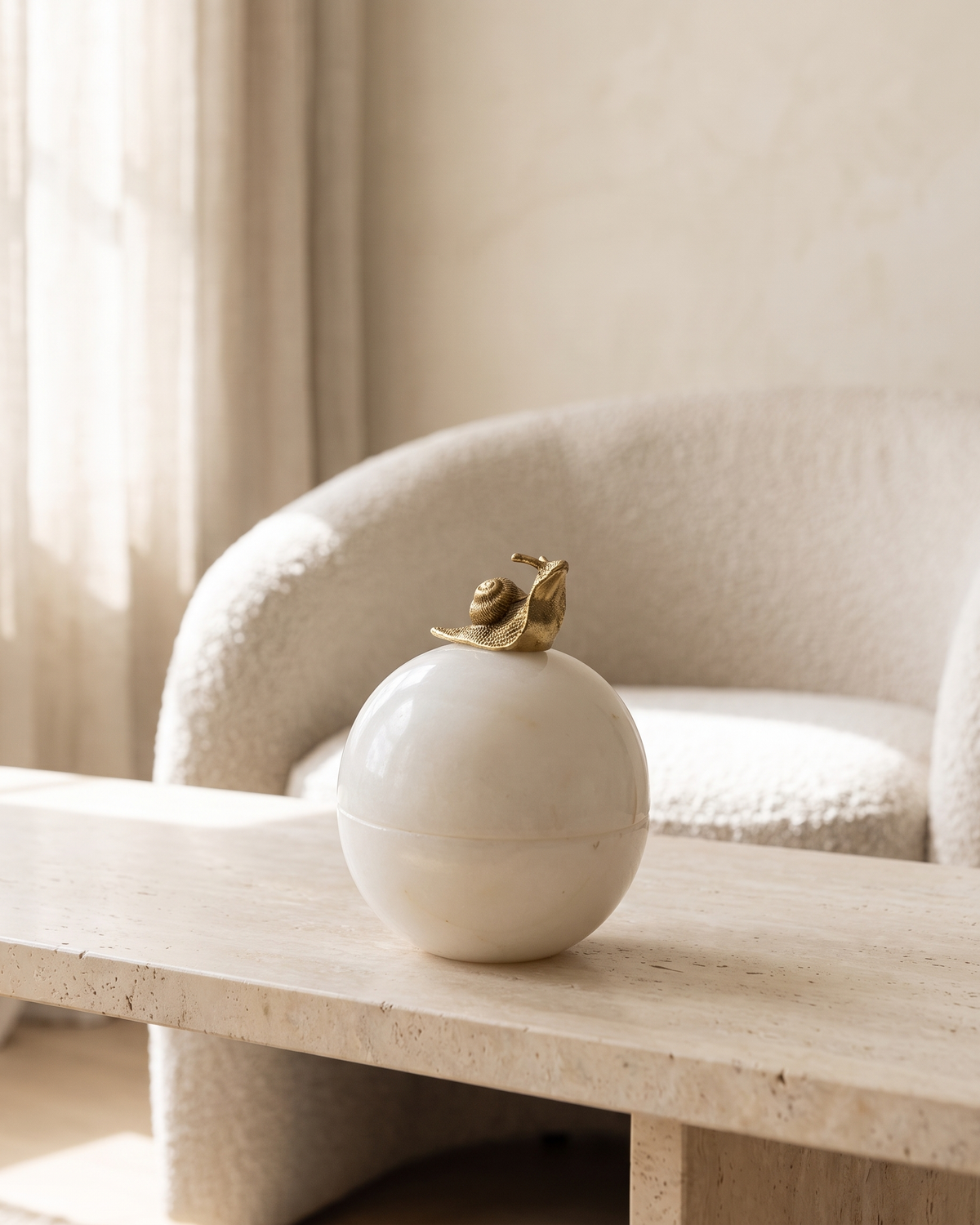Lento Snail Marble Bonbonnière - styled on a travertine console in a light interior