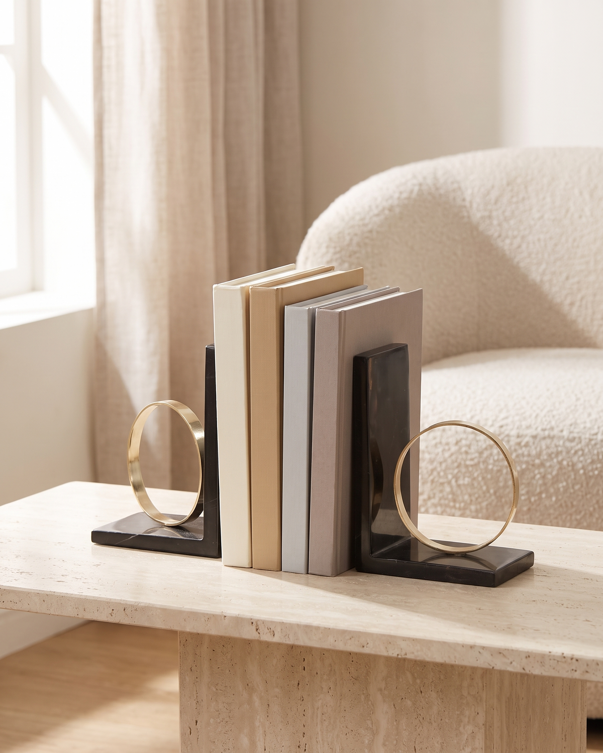 Modern Ring Bookends with Black Marble Base - styled on a travertine console holding plain books