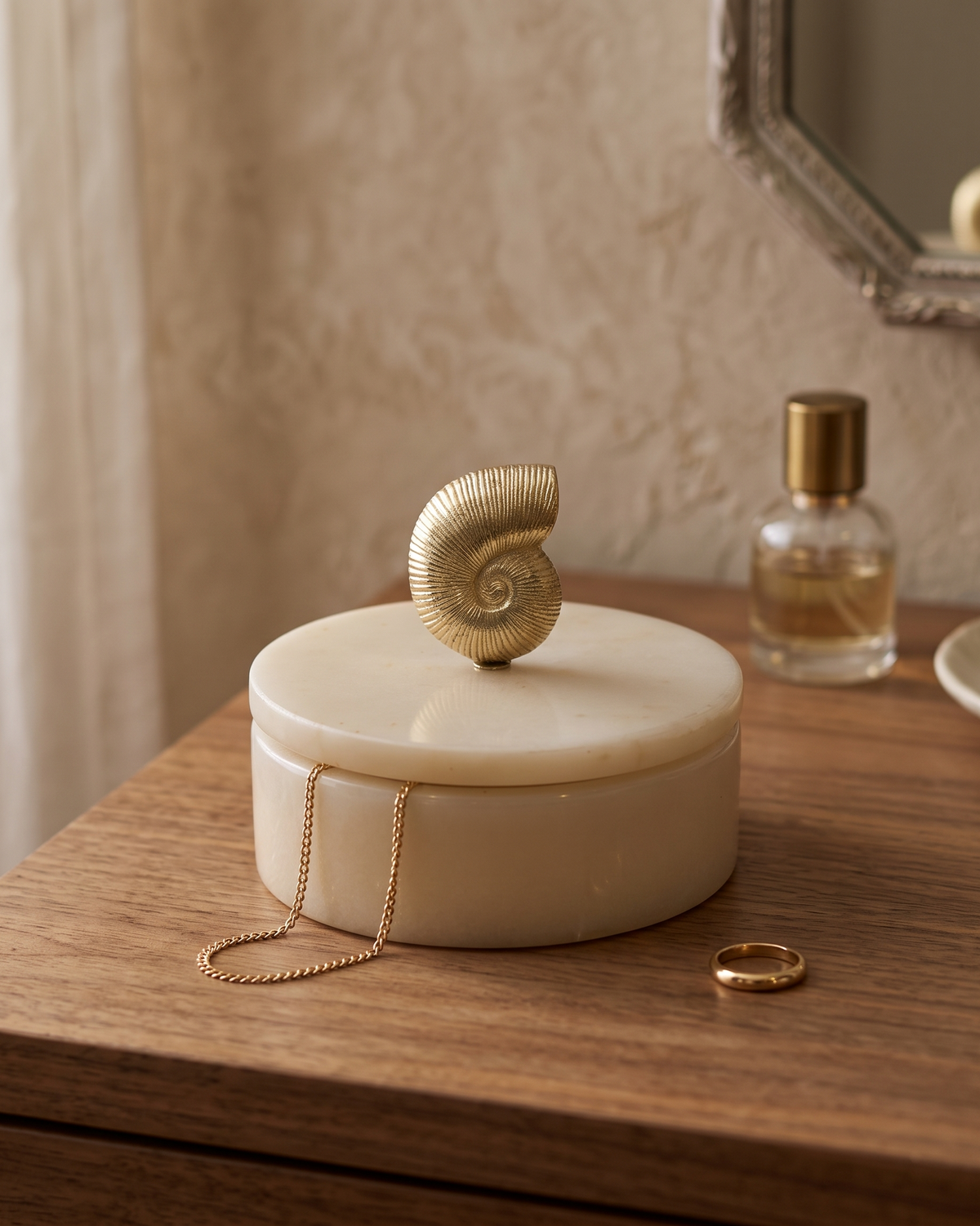 Nautilus Marble Box with Brass Shell Lid – Sculptural Marble Storage Box for Vanity styled in a warm interior setting