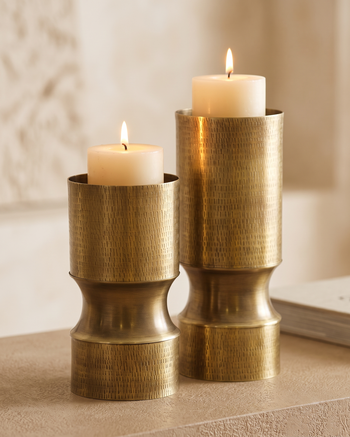 Pawed Candlestick Large - with lit candles, styled on a warm beige console in a cosy interior