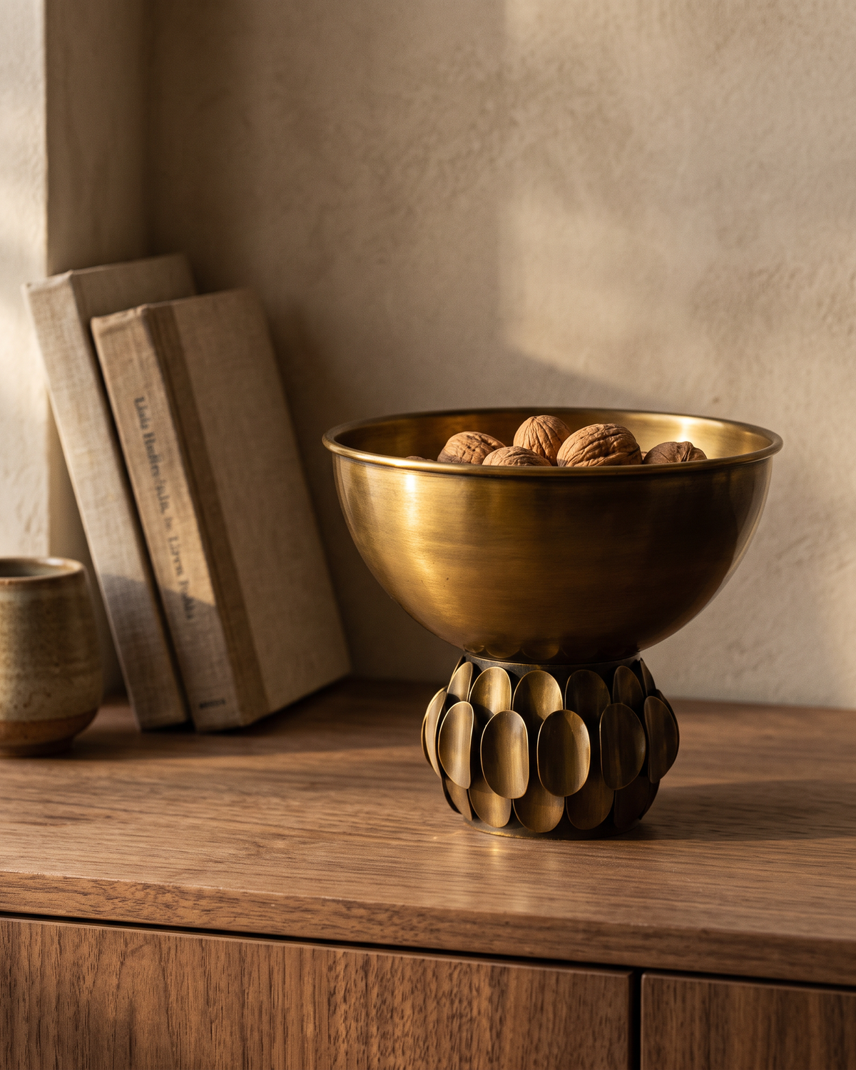 Sequined Brass Bowl styled in a warm interior setting