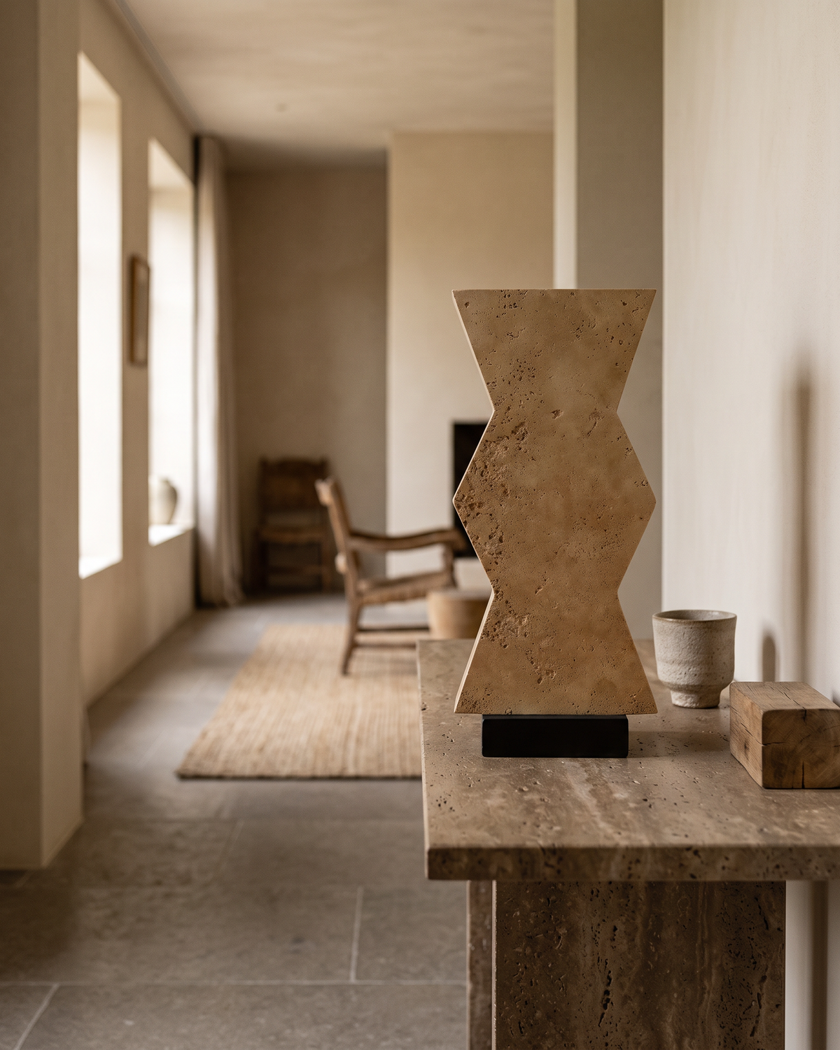 Travertine Zigzag Sculpture (One Piece) styled in a warm interior