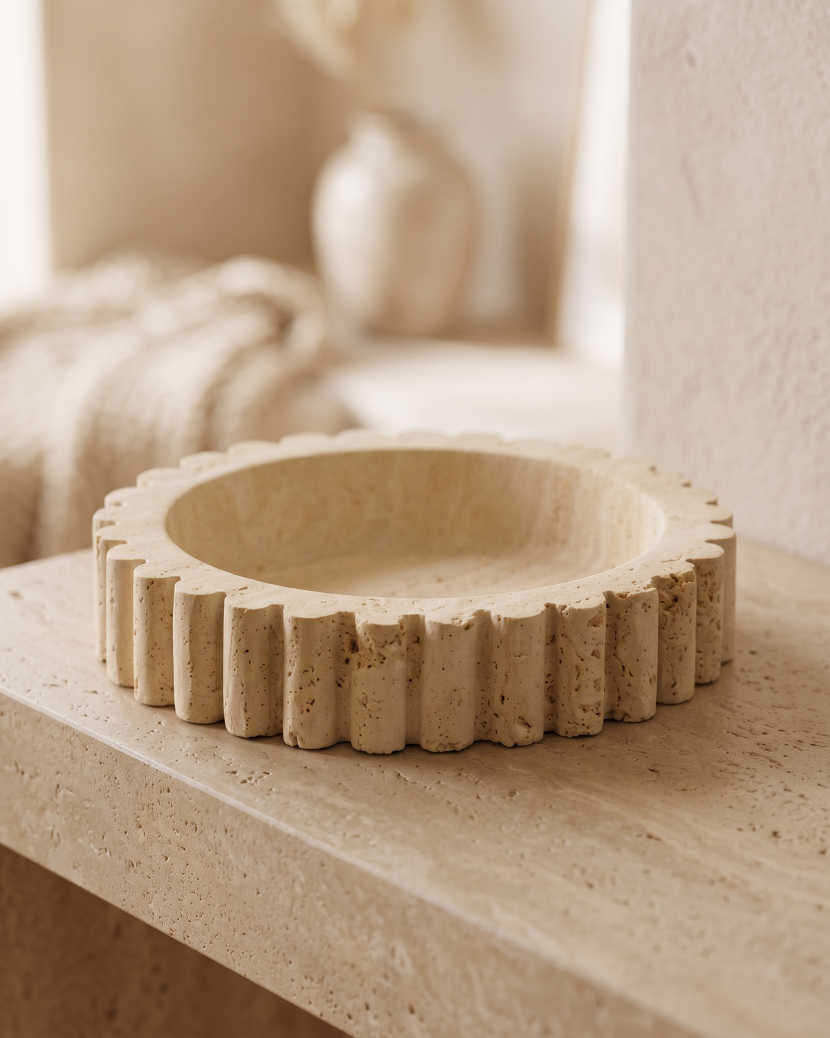 Travertine Sur Tray - styled on a warm beige console in a cosy interior