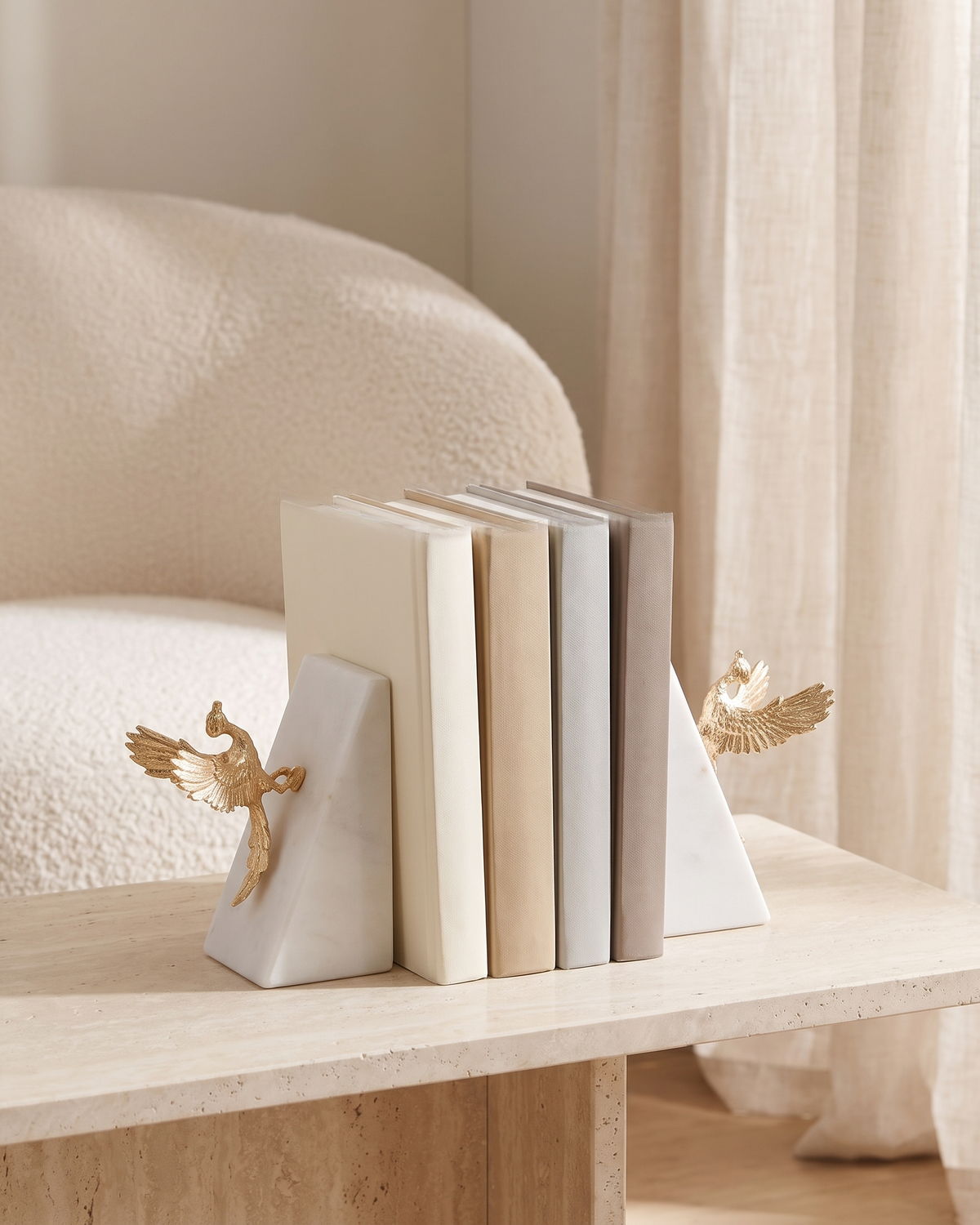 White Marble Bookends with Golden Birds - styled on a travertine console holding plain books