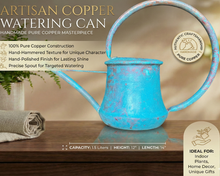 Artisan copper watering can with decorative elements on a wooden surface