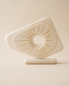 Abstract Marble Decorative Object on a pale ivory studio background
