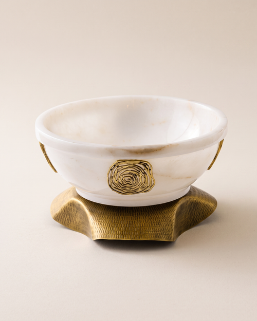 Amorphous Bowl on Brass Base II on a pale ivory studio background