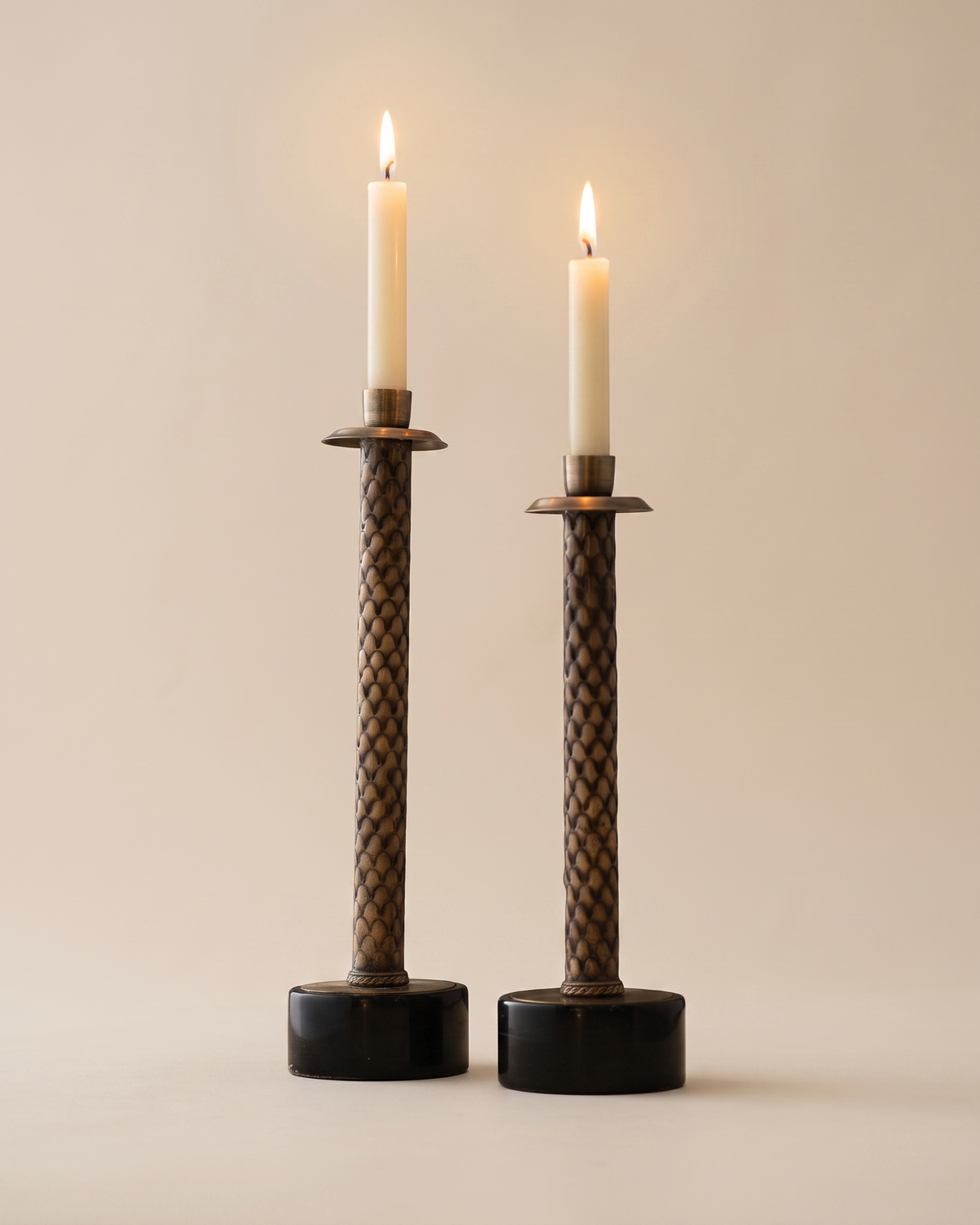 Herringbone Brass Candle Holder - with lit candles, ivory studio background