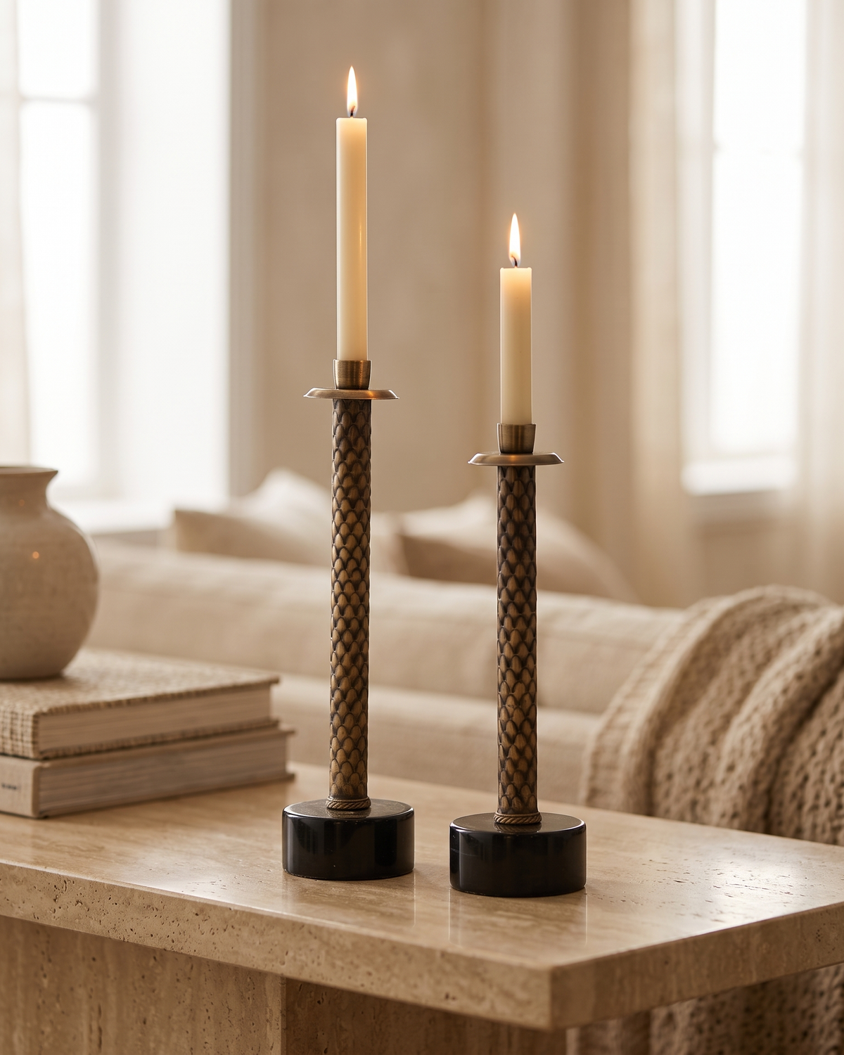 Herringbone Brass Candle Holder - with lit candles, styled on a warm beige console in a cosy interior