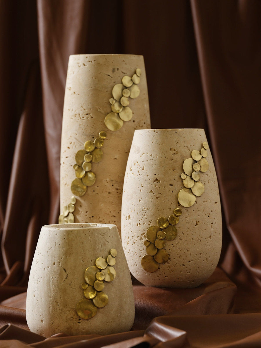 Three travertine vases with handmade brass inlay