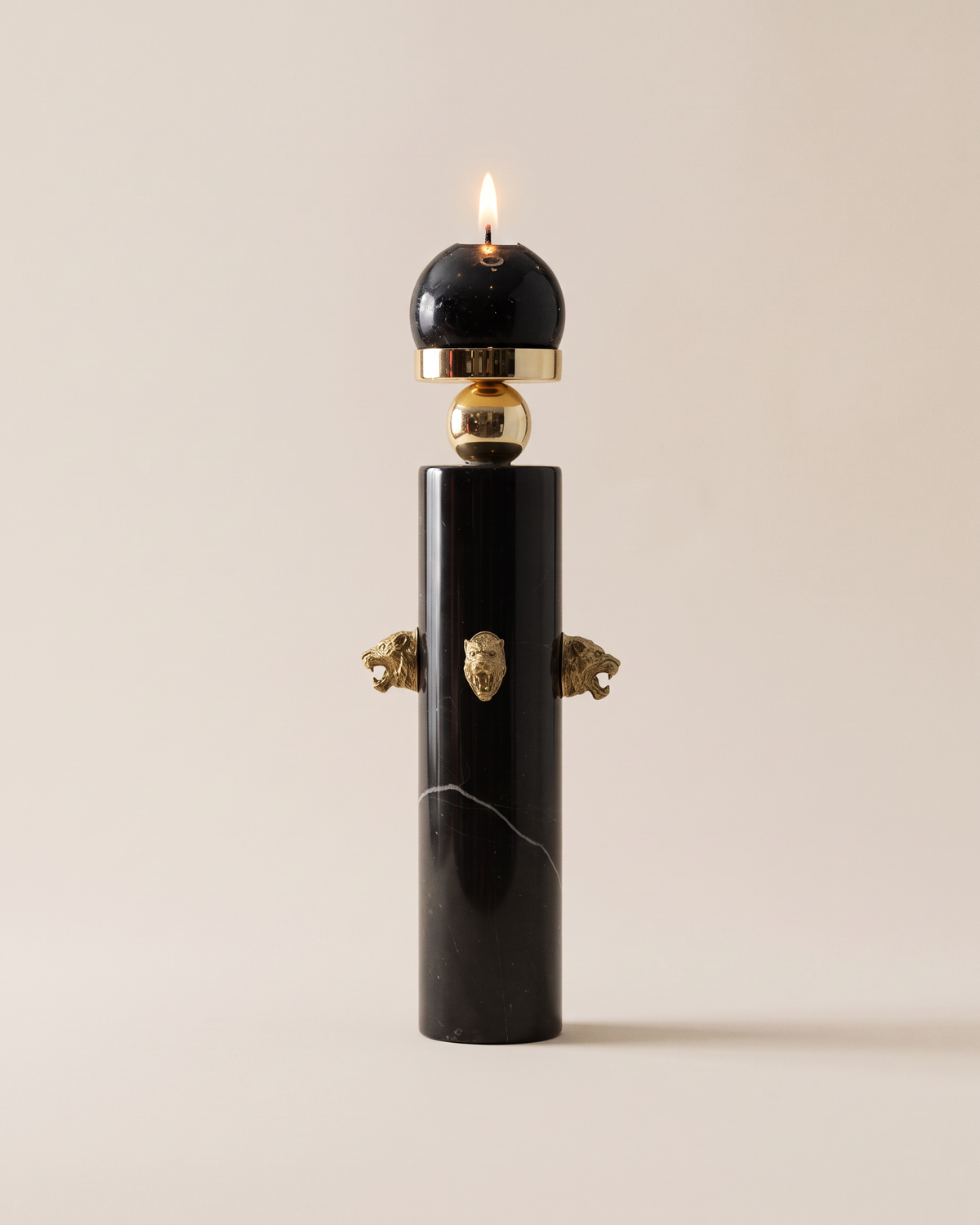 Black Marble Candle Holder with Brass Tiger Heads (One Piece) on a warm ivory studio background