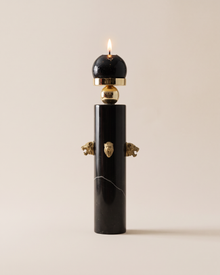 Black Marble Candle Holder with Brass Tiger Heads (One Piece) on a warm ivory studio background
