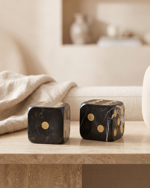 Black Marble Dice Set - styled on a warm beige console in a cosy interior