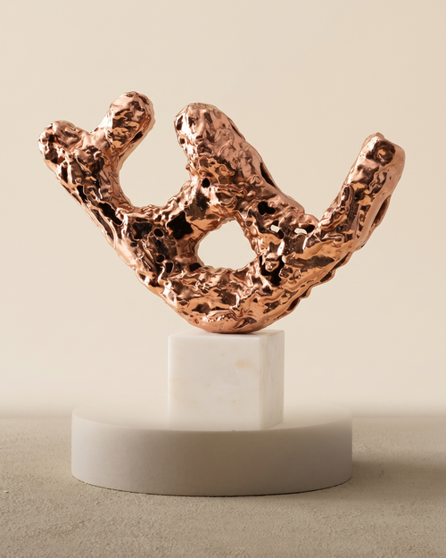 Brass Balance Log Decorative Object III - polished copper eroded branch sculpture on white marble cube, ivory studio background