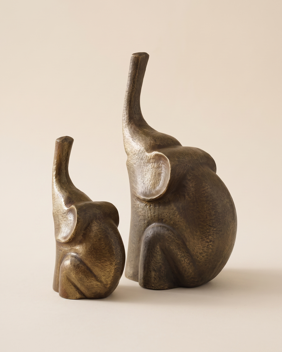 Brass Elephant Decorative Object IV - two antiqued bronze elephant sculptures, ivory studio background