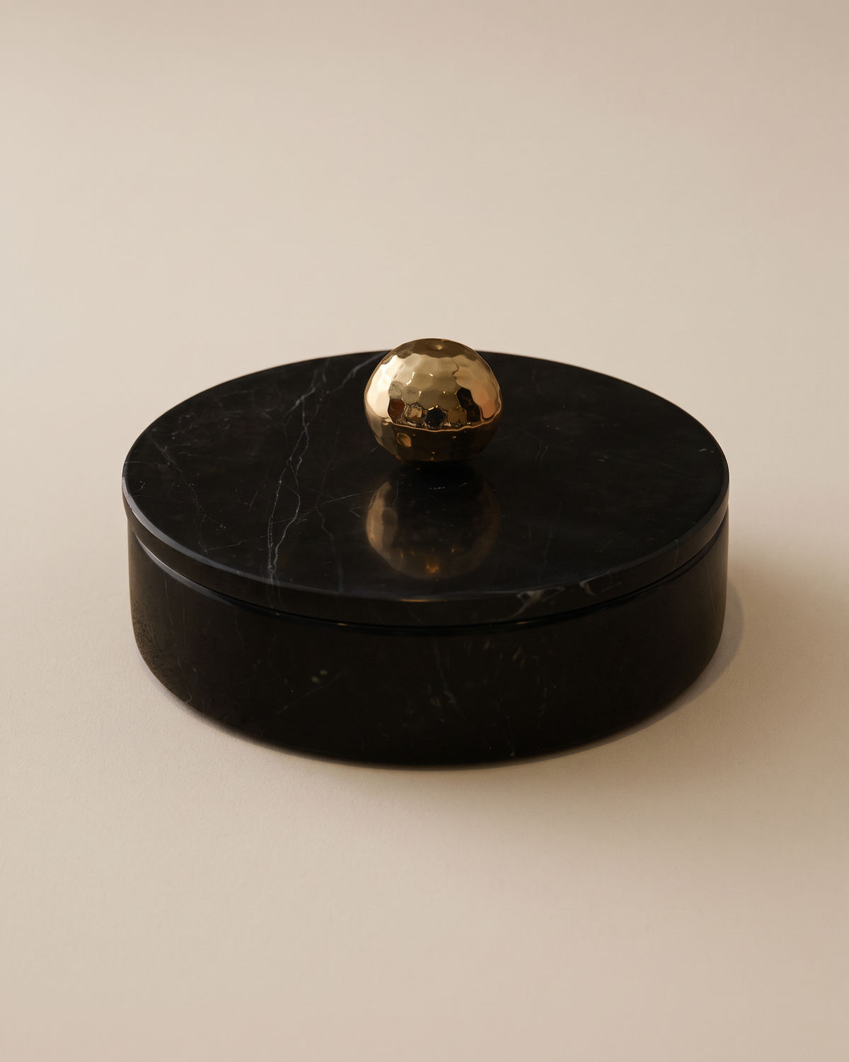 Black Marble Box with Brass Knob (One Piece) on a warm ivory studio background