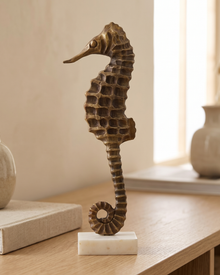 Brass Seahorse Decorative Object Antiqued - styled on a warm beige console in a cosy interior