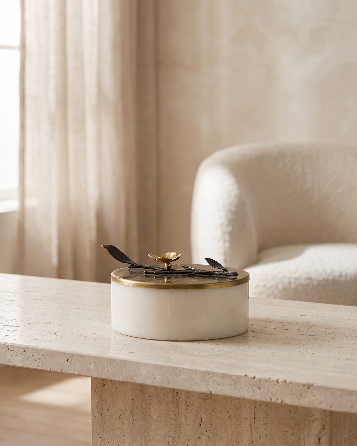 Brass Branch Marble Box with Sculptural Botanical Lid - styled on a travertine console in a light interior