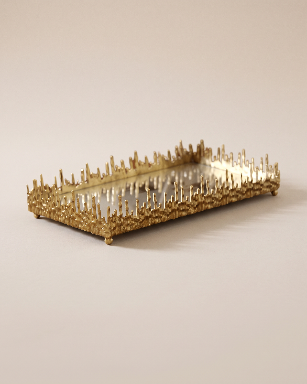 Dory Sculptural Mirrored Tray, Gold (One Piece) on a warm ivory studio background