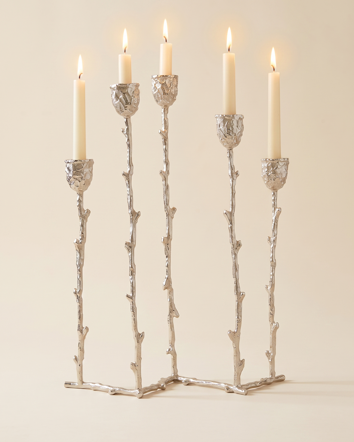 Five-Arm Brass Candelabra Silver - with lit candles, ivory studio background