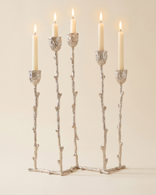 Five-Arm Brass Candelabra Silver - with lit candles, ivory studio background