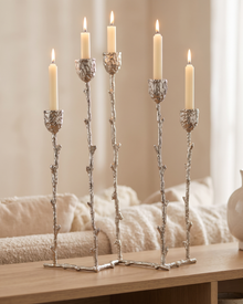 Five-Arm Brass Candelabra Silver - with lit candles, styled on a warm beige console in a cosy interior