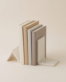 Geometric Marble Bookend Set - studio view on ivory background, holding a row of plain books