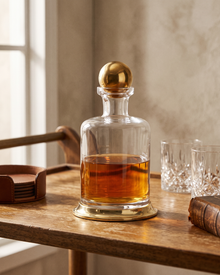 Glass Decanter with Brass Base & Sphere Lid (One Piece) styled in a warm interior
