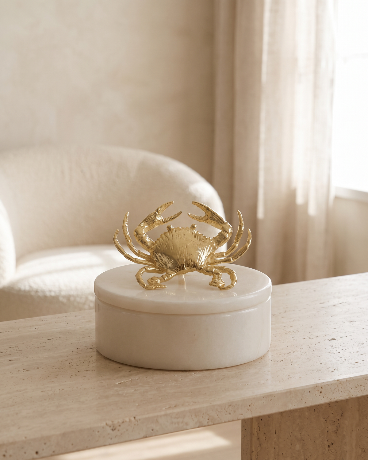 Gold Crab Marble Box with Brass Crab Sculpture - styled on a travertine console in a light interior