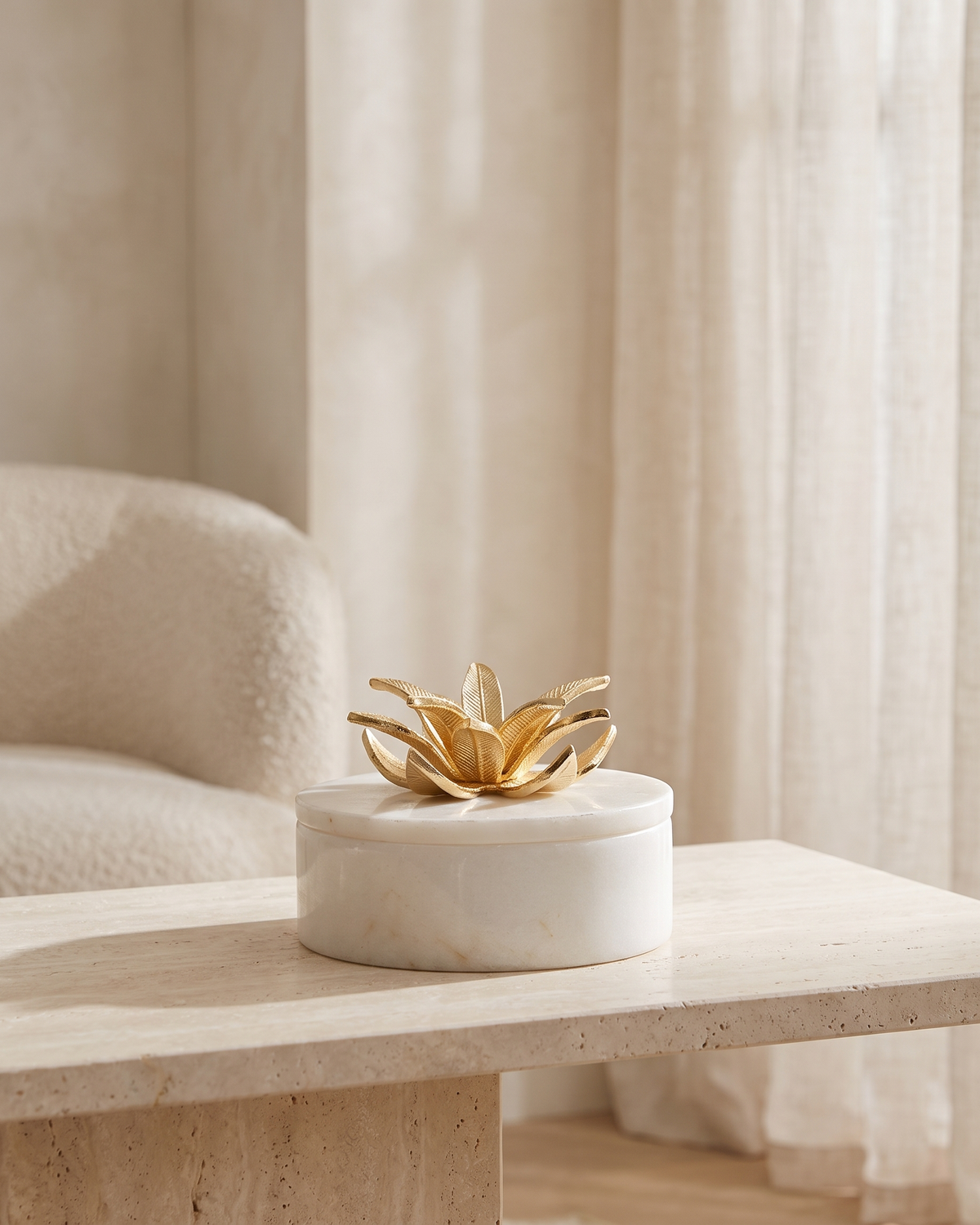 Golden Petal Marble Bonbonniere with Brass Floral Lid - styled on a travertine console in a light interior