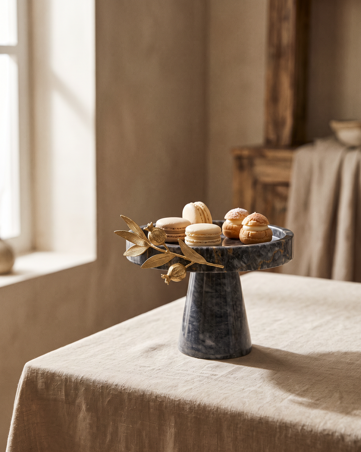 Grey Marble Cake Stand with Gold Pomegranate (One Piece) styled in a warm interior