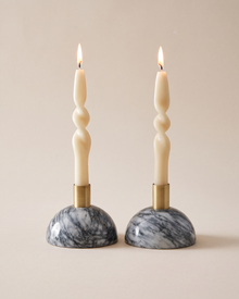 Half-Moon Marble Candlesticks (Set of 2) on a warm ivory studio background
