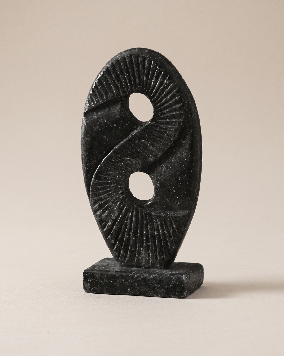 Yin-Yang Relief Sculpture (One Piece) on a warm ivory studio background