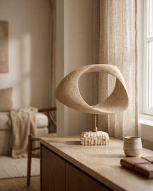 Travertine Twisted Ring Sculpture (One Piece) styled in a warm interior