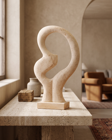Travertine Abstract Loop Sculpture (One Piece) styled in a warm interior
