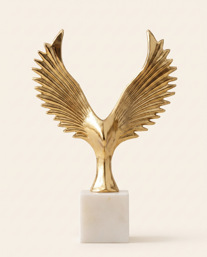 Golden Winged Bird Sculpture on White Marble Base