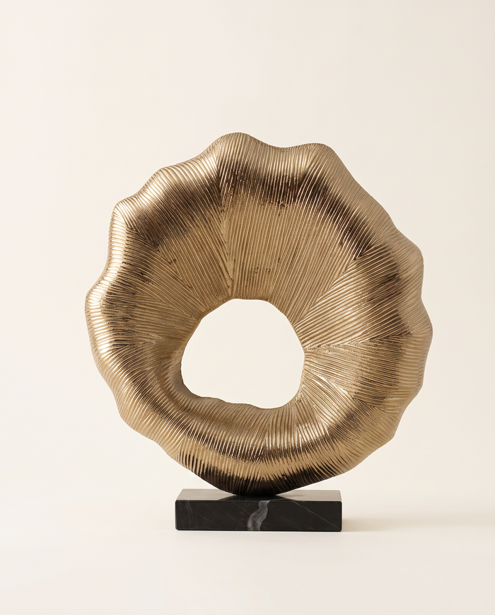 Golden Sunburst Ring Sculpture on Black Marble Base