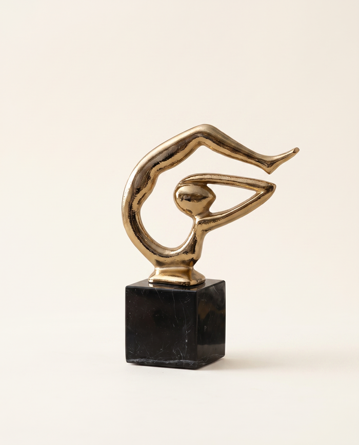 Golden Abstract Figurine on Black Marble Base