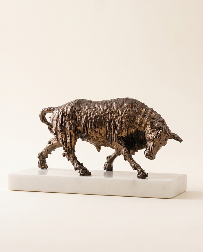 Bronze Bull Sculpture On White Marble Base