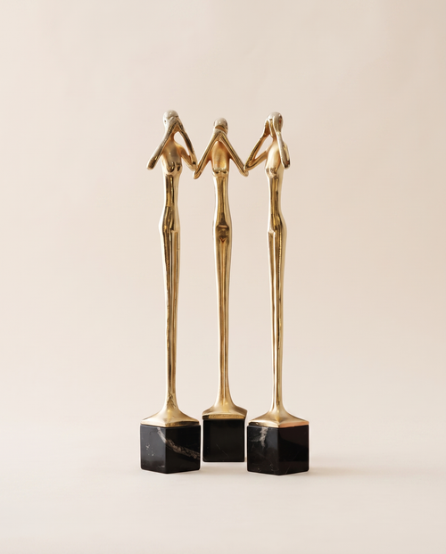 Brass Three Wise Women Sculpture - warm ivory studio hero shot