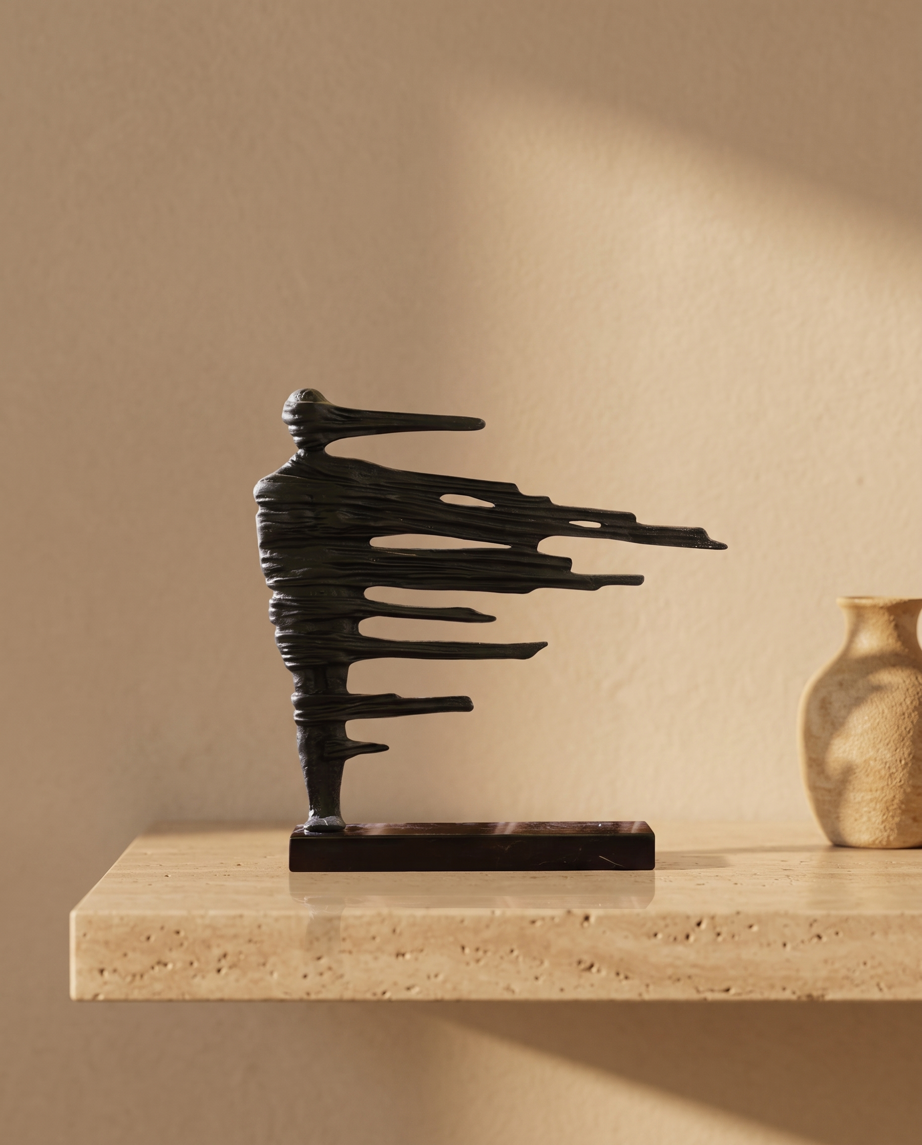 Brass Wind Woman Sculpture - styled warm beige console scene