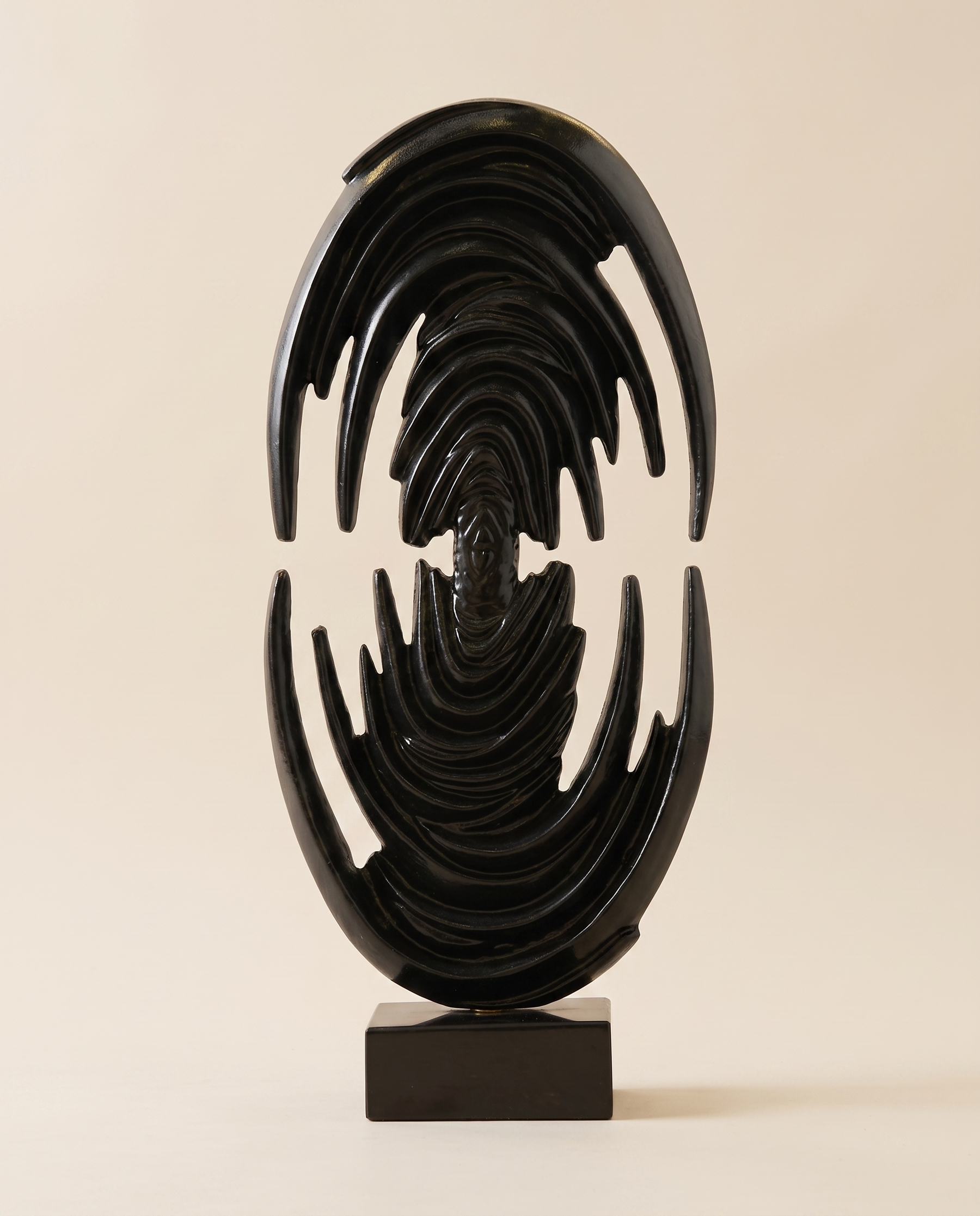 Glossy Black Brass Art Sculpture Venus Form - warm ivory studio hero shot