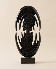 Glossy Black Brass Art Sculpture Venus Form - warm ivory studio hero shot